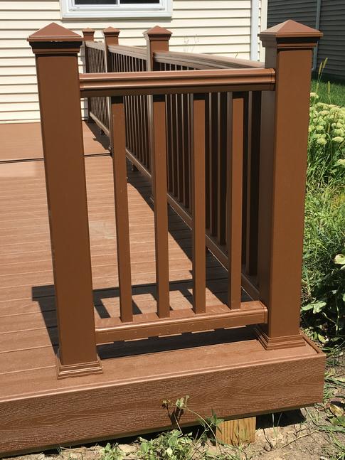 Trex Transcend railing, color "Tree House" 2017 A-Affordable Decks. This deck was built in Lisle