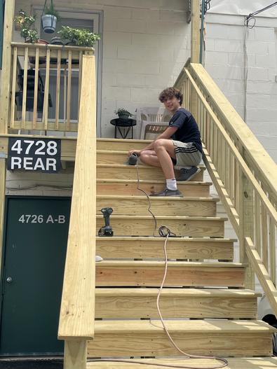 That's better! Francesco doing a final sanding of this staircase in Lisle IL A-Affordable Decks